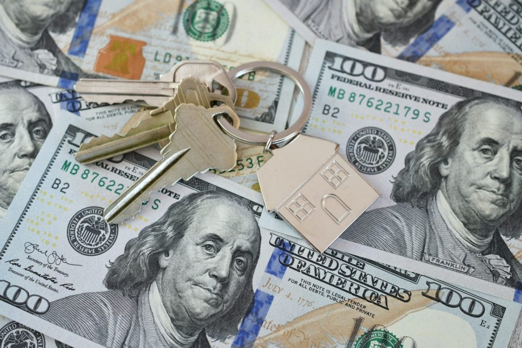 Housing Market Concept - House Keys On Money Currency, Real Estate, Home For Sale, Equity Buy Sell